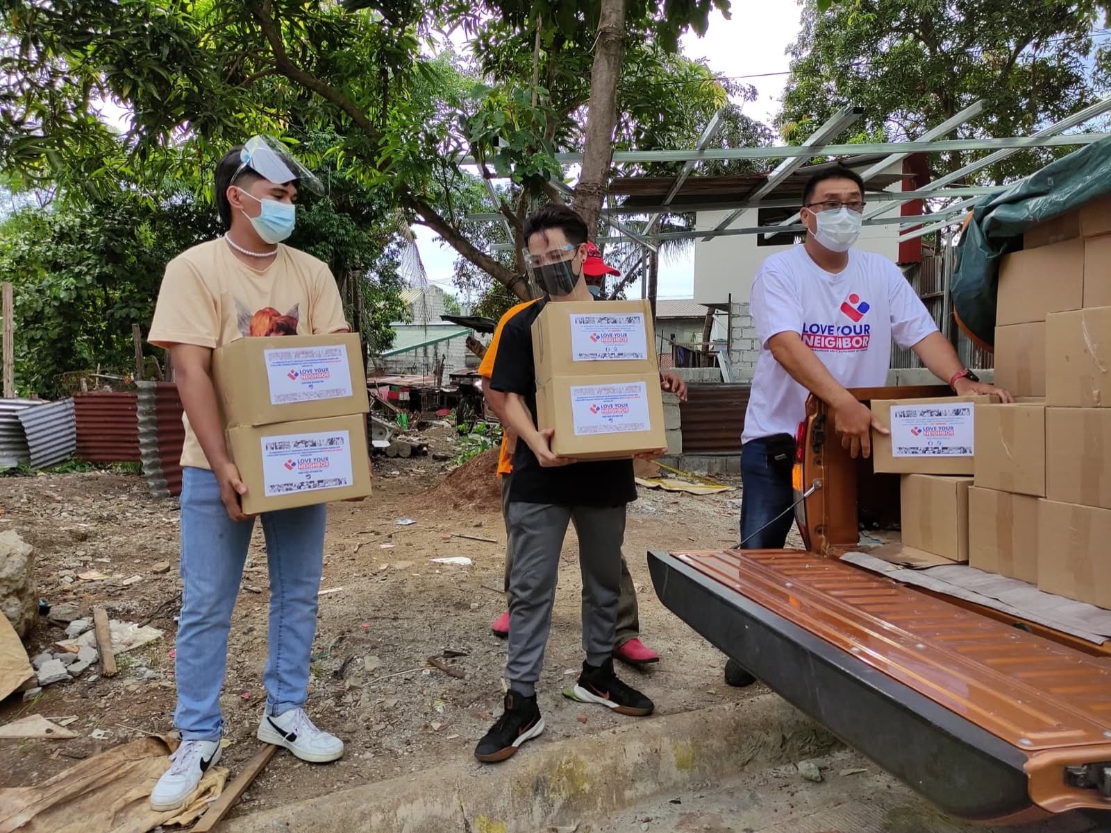 Love Your Neighbor food-pack distribution