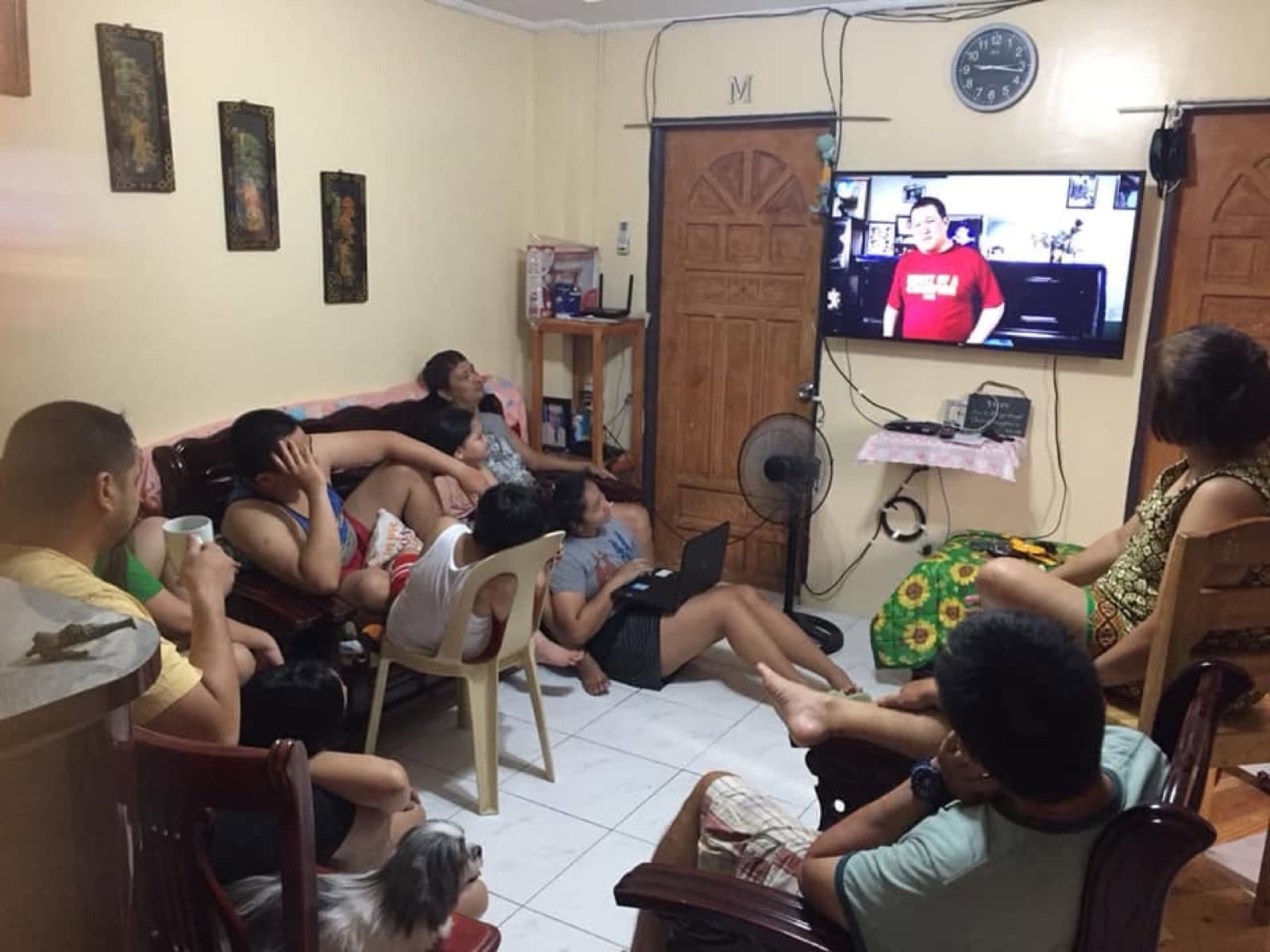 A family worshiping online at home