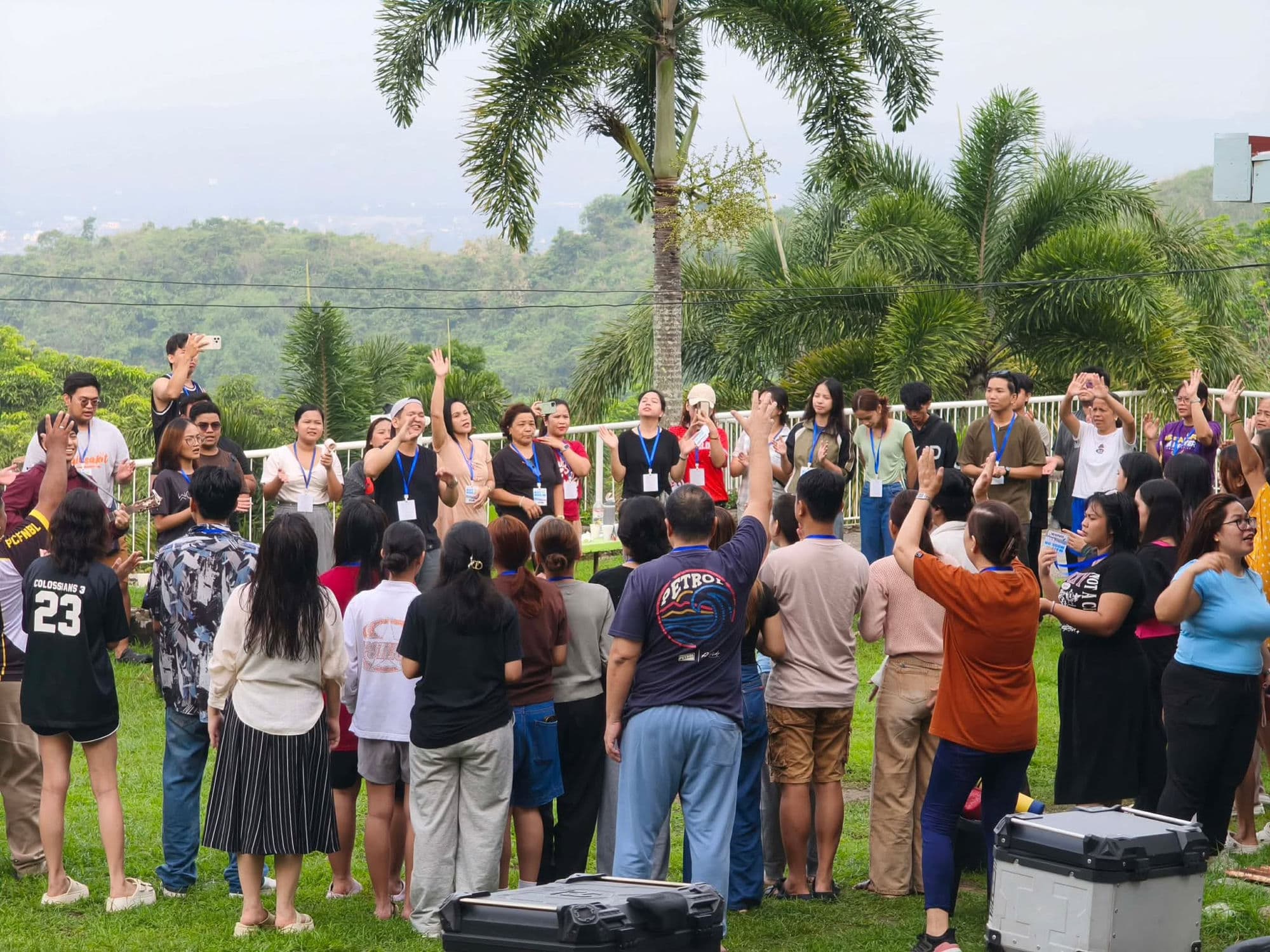 PCF Novaliches members worshiping together outdoors